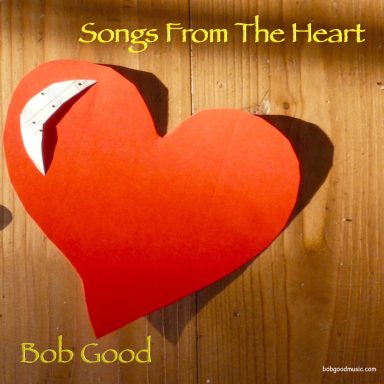 Red cardboard heart on wood flooring